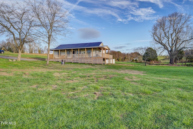 view of front facade with a front yard and a porch