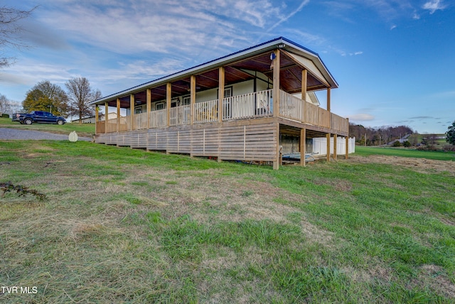 back of property featuring a lawn