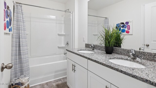 1711 Fox Meadows Cir, Bluff City, TN 37618 - full bathroom featuring double vanity, shower / tub combo with curtain, and a sink