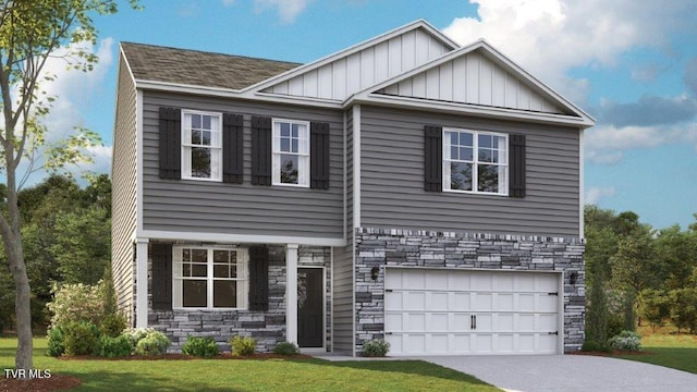 craftsman inspired home with a garage and a front lawn