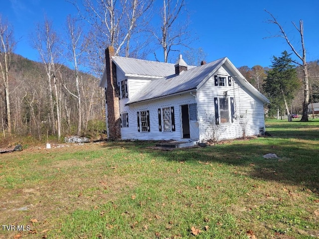 view of property exterior featuring a yard