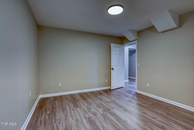 unfurnished room with light wood-type flooring