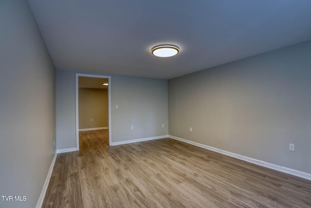 spare room featuring light wood-type flooring