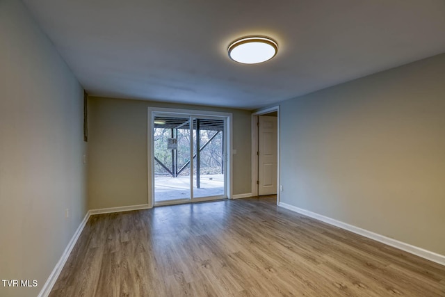 spare room featuring light hardwood / wood-style flooring