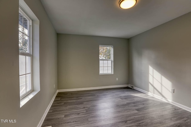 empty room featuring dark wood-type flooring