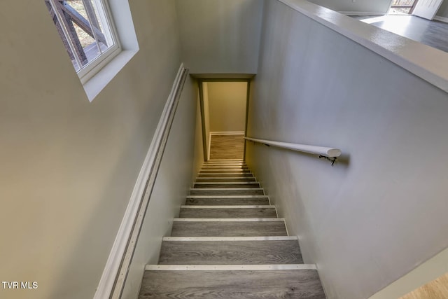 stairs with wood-type flooring