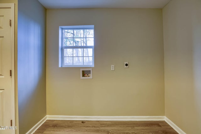 clothes washing area featuring hardwood / wood-style floors, hookup for an electric dryer, and hookup for a washing machine