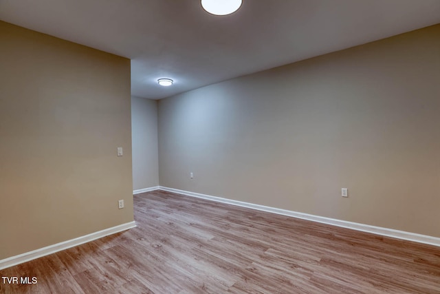 spare room featuring light hardwood / wood-style flooring