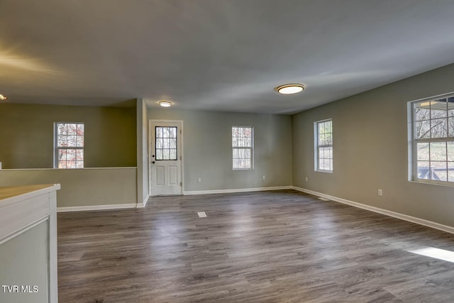 empty room featuring dark wood-type flooring