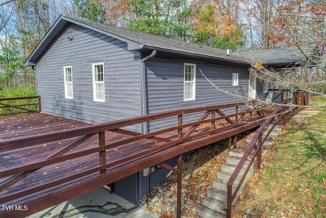 back of house featuring a deck