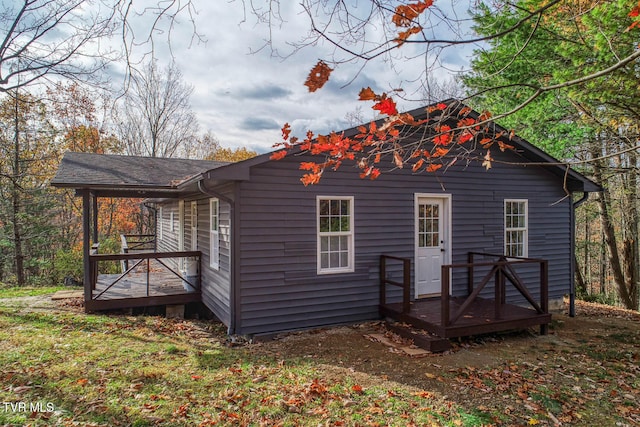 rear view of property with a deck