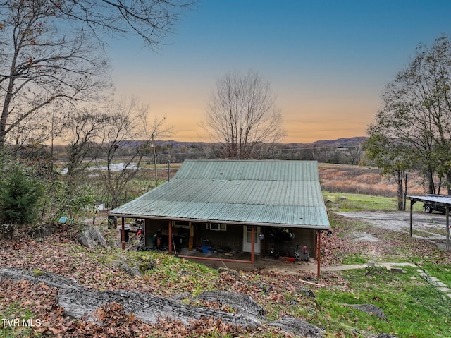 view of back house at dusk