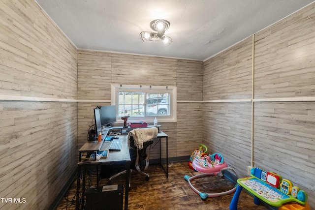 office with hardwood / wood-style floors and wood walls