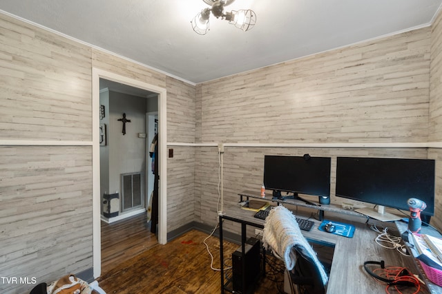 office with wood walls and dark wood-type flooring