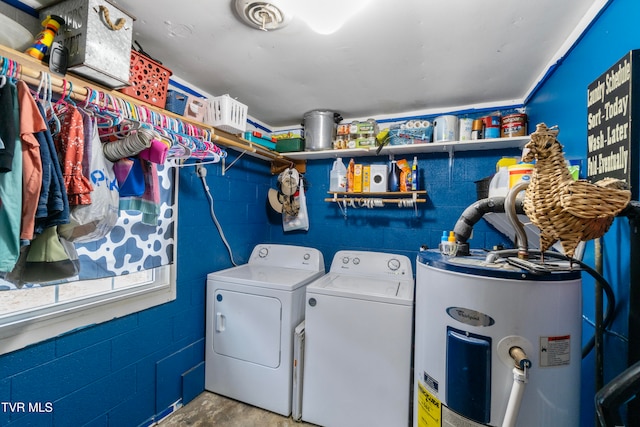 laundry area with washer and dryer and water heater