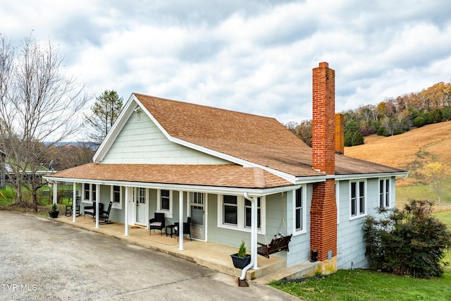 country-style home with a porch