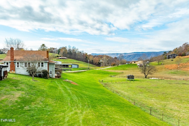 view of yard featuring a mountain view and a rural view