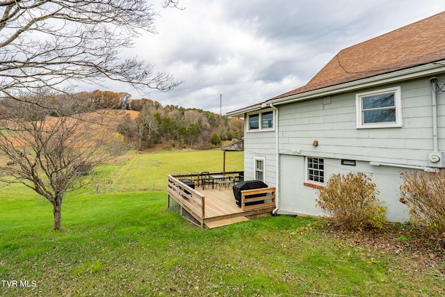 view of yard featuring a wooden deck