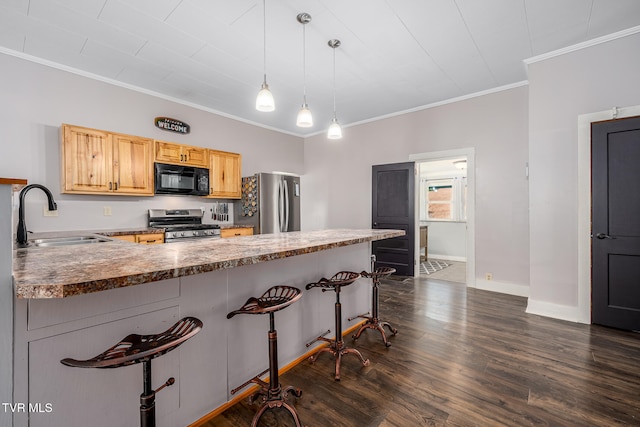 kitchen with pendant lighting, sink, ornamental molding, kitchen peninsula, and stainless steel appliances