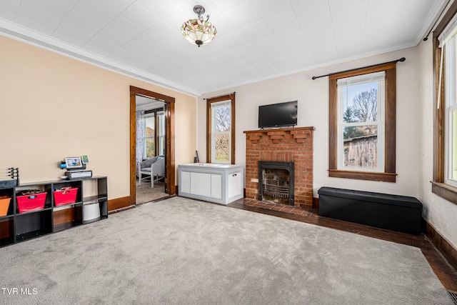 carpeted living room featuring ornamental molding