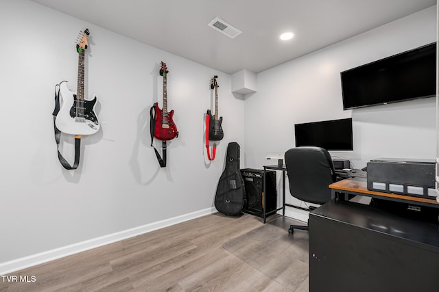 office space with light hardwood / wood-style flooring