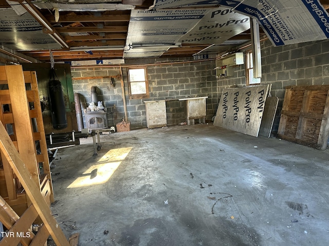 basement featuring a wood stove