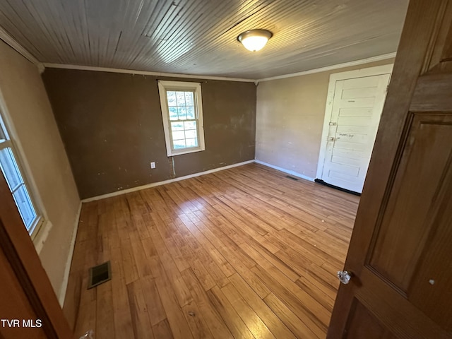 unfurnished room with light hardwood / wood-style floors and ornamental molding