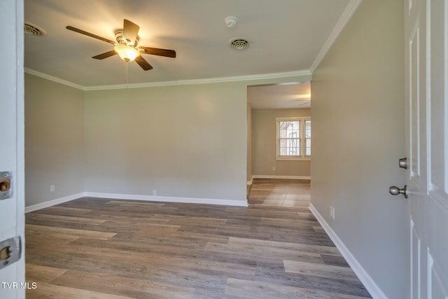 empty room with light hardwood / wood-style flooring, ceiling fan, and crown molding