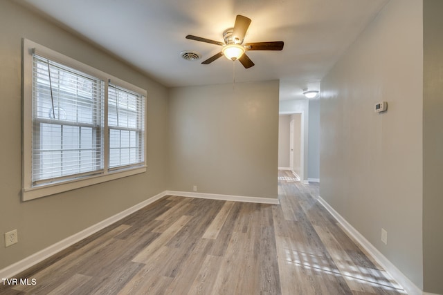 unfurnished room featuring ceiling fan and light hardwood / wood-style flooring