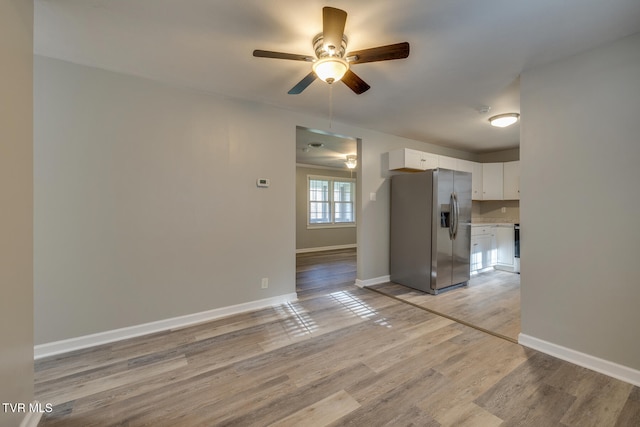 interior space with ceiling fan and light wood-type flooring