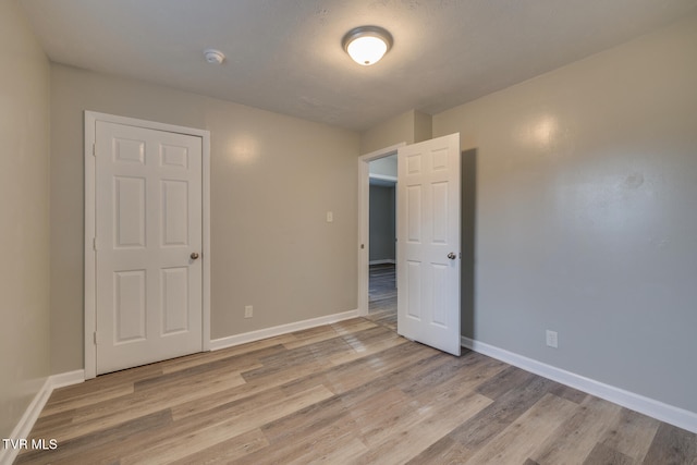 unfurnished bedroom with light hardwood / wood-style floors