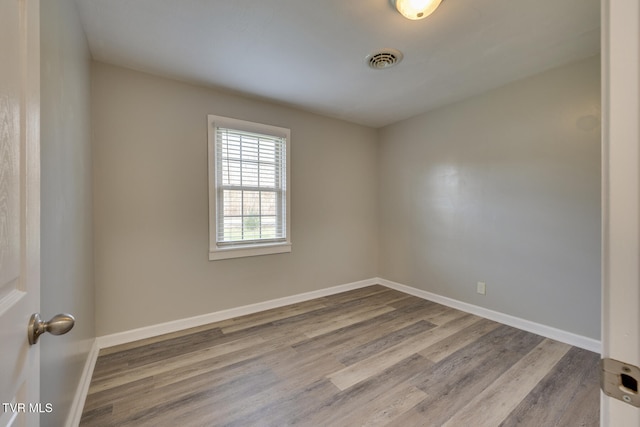 spare room featuring light wood-type flooring