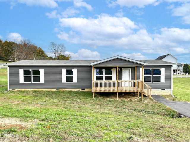 307 Bungalow Dr, Dandridge, TN 37725 - manufactured / mobile home featuring a front yard and a wooden deck