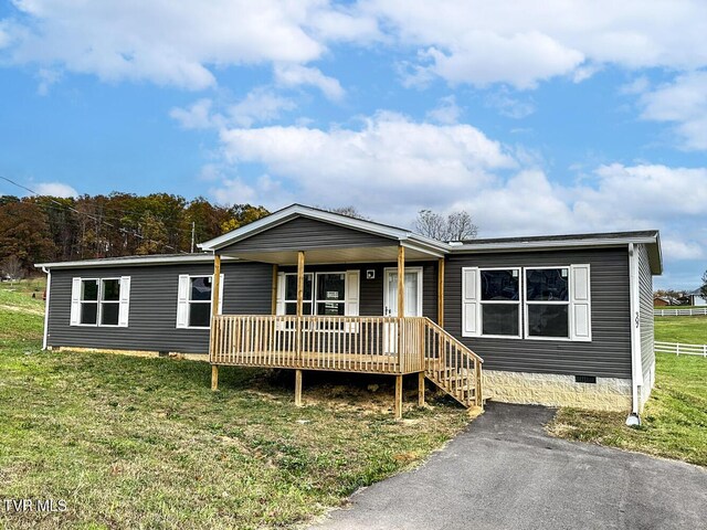 307 Bungalow Dr, Dandridge, TN 37725 - manufactured / mobile home with a porch and a front lawn