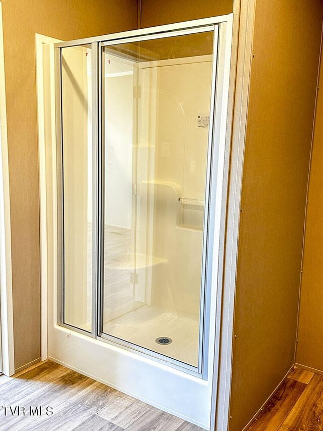307 Bungalow Dr, Dandridge, TN 37725 - bathroom with hardwood / wood-style floors and a shower with shower door