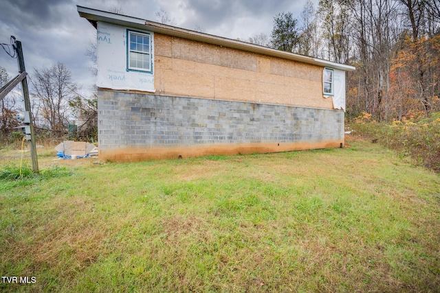 view of home's exterior with a lawn