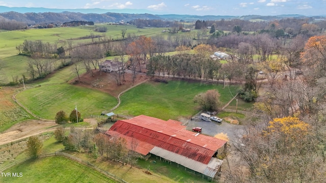 birds eye view of property featuring a mountain view and a rural view