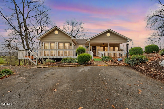 view of front of home with covered porch and ceiling fan