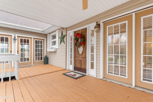 view of exterior entry with covered porch