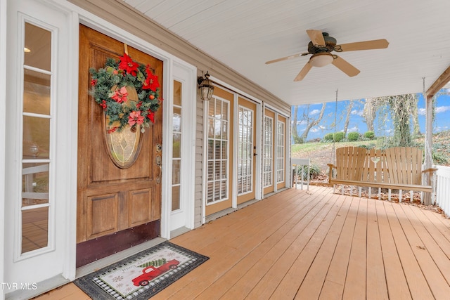 deck featuring ceiling fan and covered porch