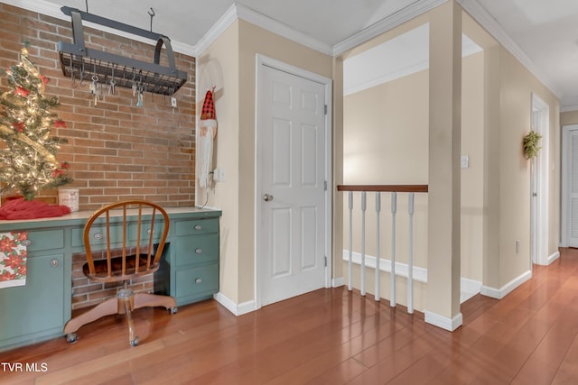 office featuring wood-type flooring and crown molding