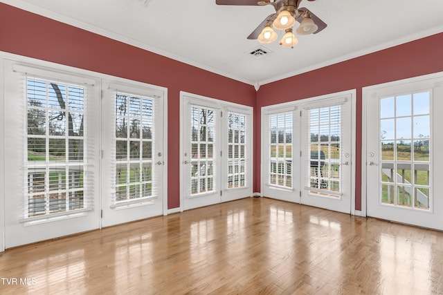 interior space featuring ceiling fan and a healthy amount of sunlight