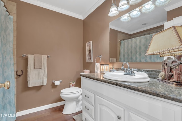 bathroom with vanity, toilet, wood-type flooring, and crown molding