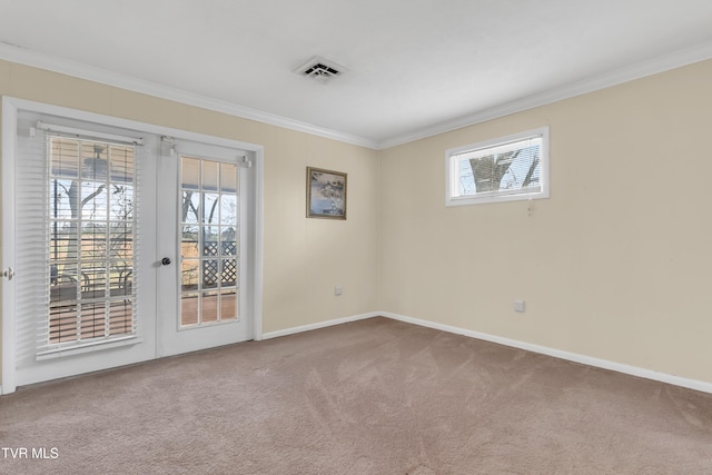 carpeted empty room with a healthy amount of sunlight and ornamental molding