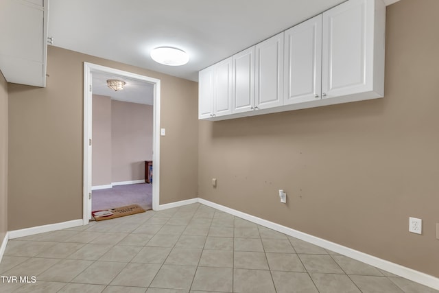 laundry room with light tile patterned floors