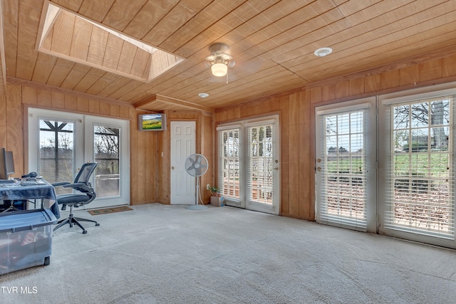 office with wooden walls, wooden ceiling, and a wealth of natural light