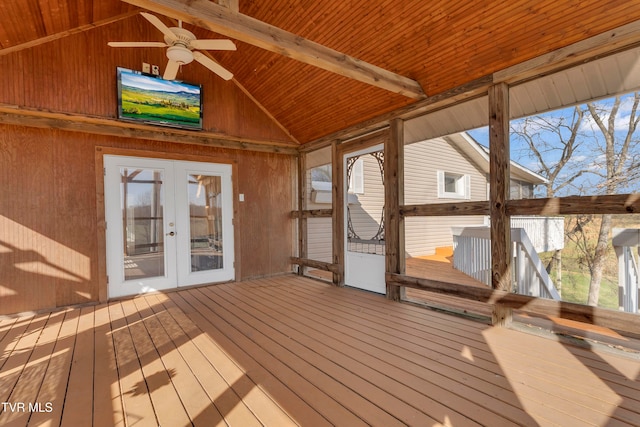 unfurnished sunroom with vaulted ceiling with beams, ceiling fan, wood ceiling, and french doors