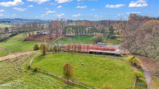 birds eye view of property with a mountain view and a rural view