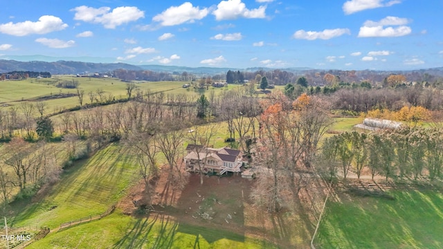 birds eye view of property with a mountain view and a rural view