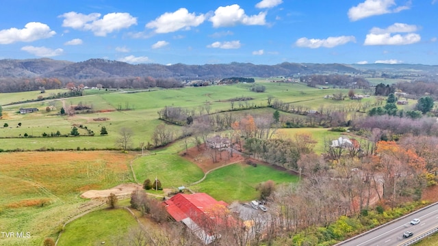 drone / aerial view featuring a mountain view and a rural view